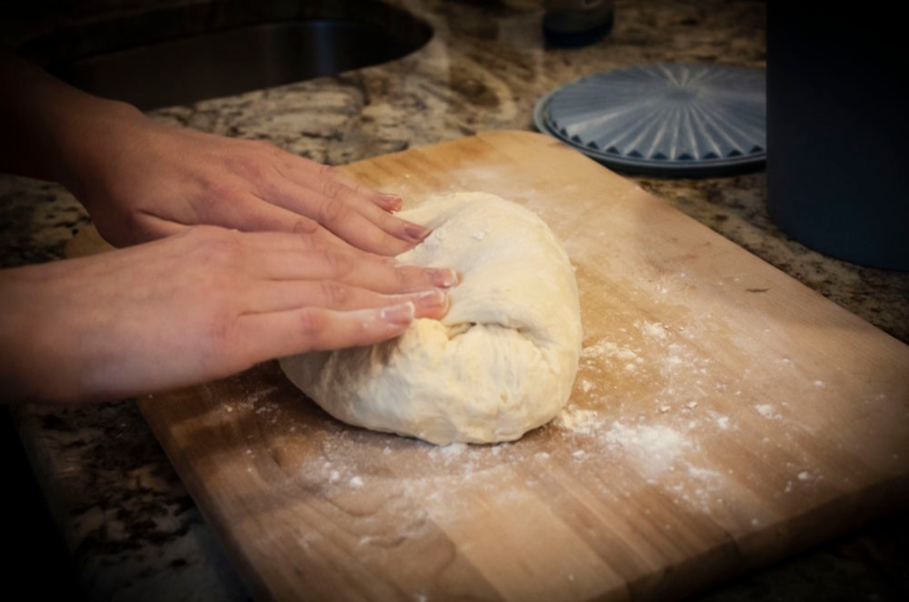 Fold dough until it resists
